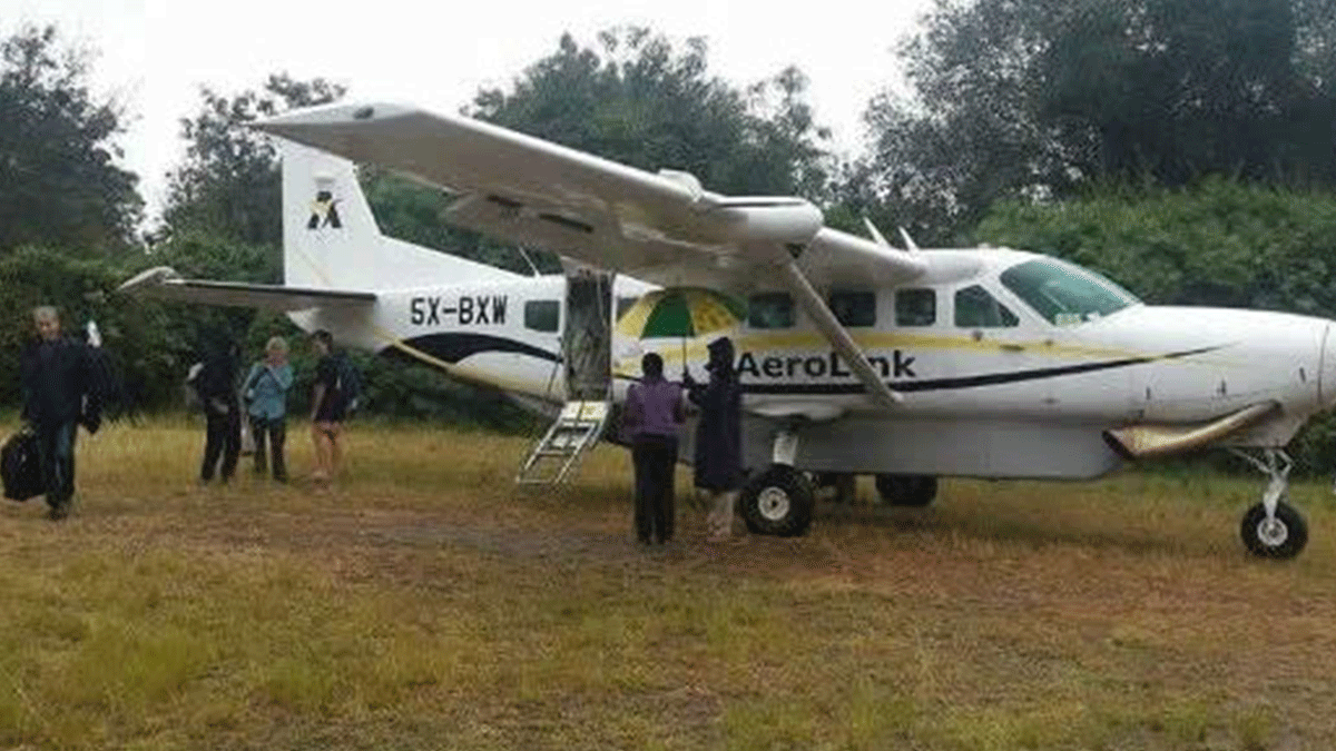 Tourists after landing at Kihihi airstrip near Bwindi impenetrable national park